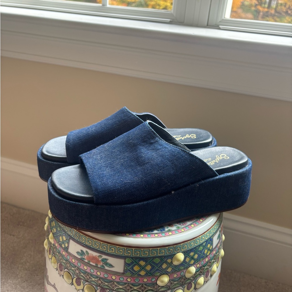Navy blue suede platform sandals with a 3" heel